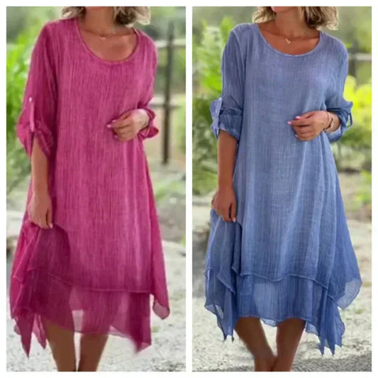 Yksivärinen elegantti naisten mekko pyöreällä pääntiellä ja väljällä leikkauksella